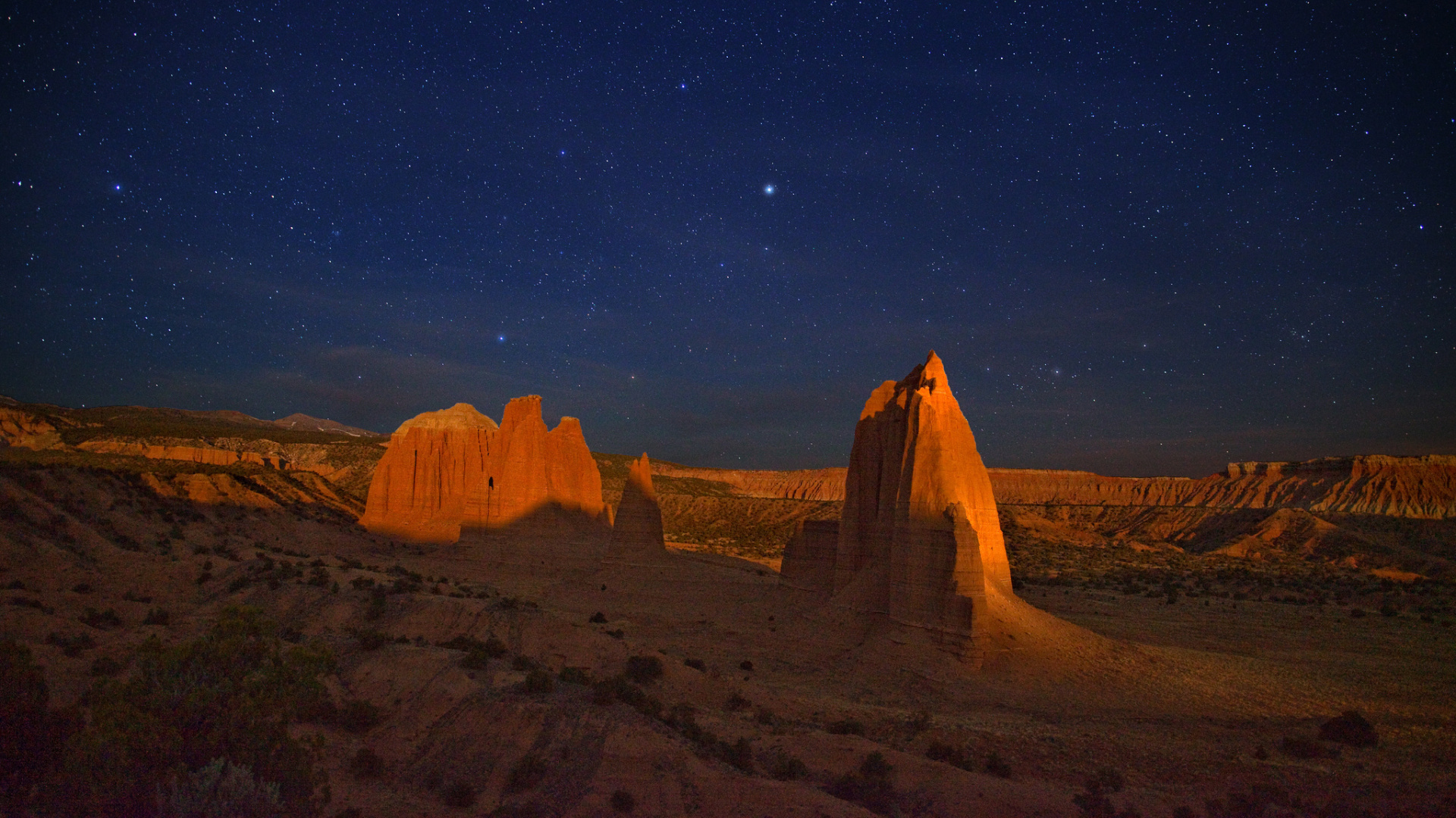 Brown Rock Formation Under Blue Sky During Night Time. Wallpaper in 1920x1080 Resolution