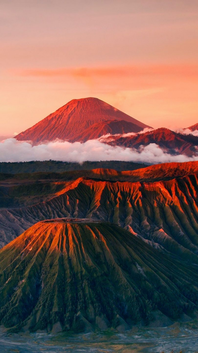 Brown and Green Mountain Under White Clouds During Daytime. Wallpaper in 750x1334 Resolution