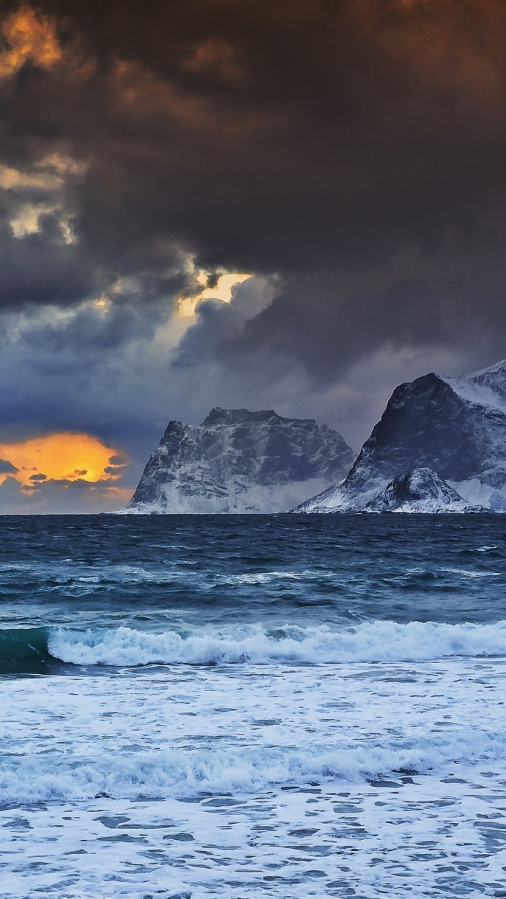 Snow Covered Mountain Near Body of Water During Daytime. Wallpaper in 720x1280 Resolution