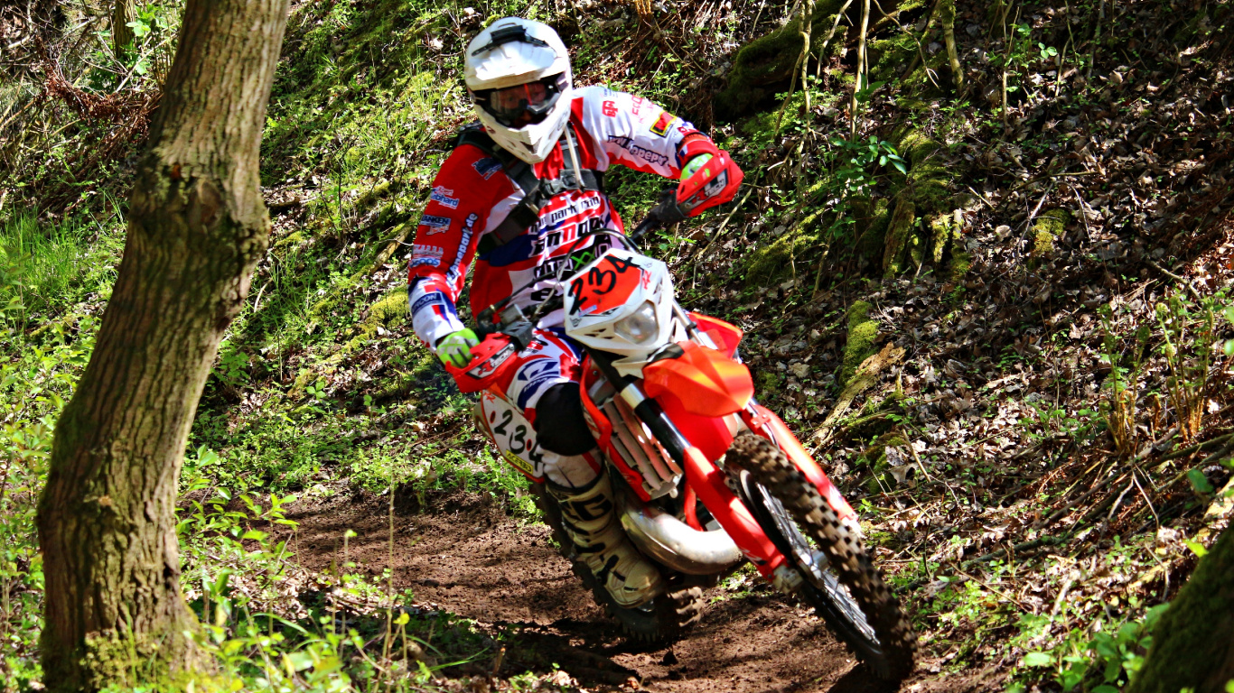 Man in Red and White Motocross Suit Riding Motocross Dirt Bike. Wallpaper in 1366x768 Resolution