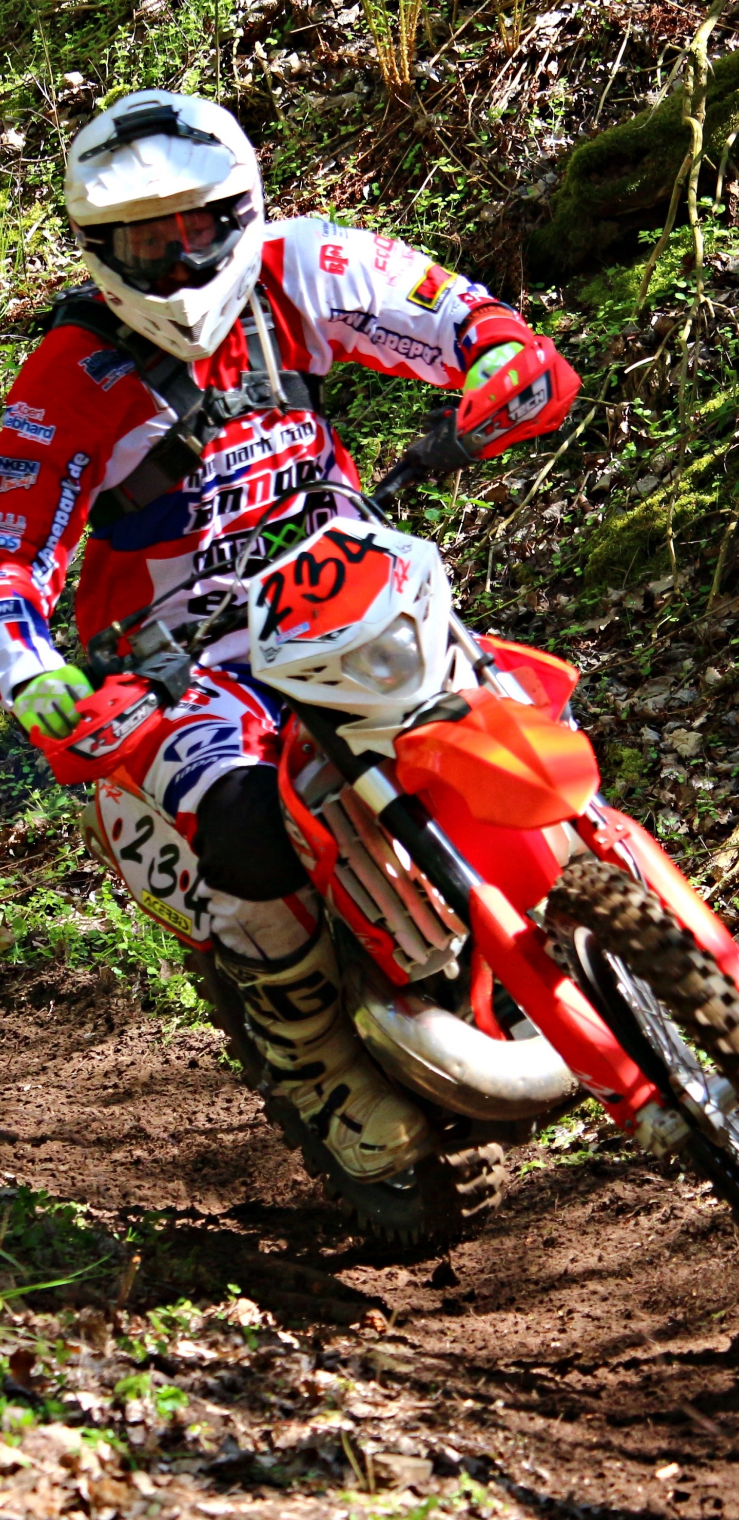 Man in Red and White Motocross Suit Riding Motocross Dirt Bike. Wallpaper in 1440x2960 Resolution