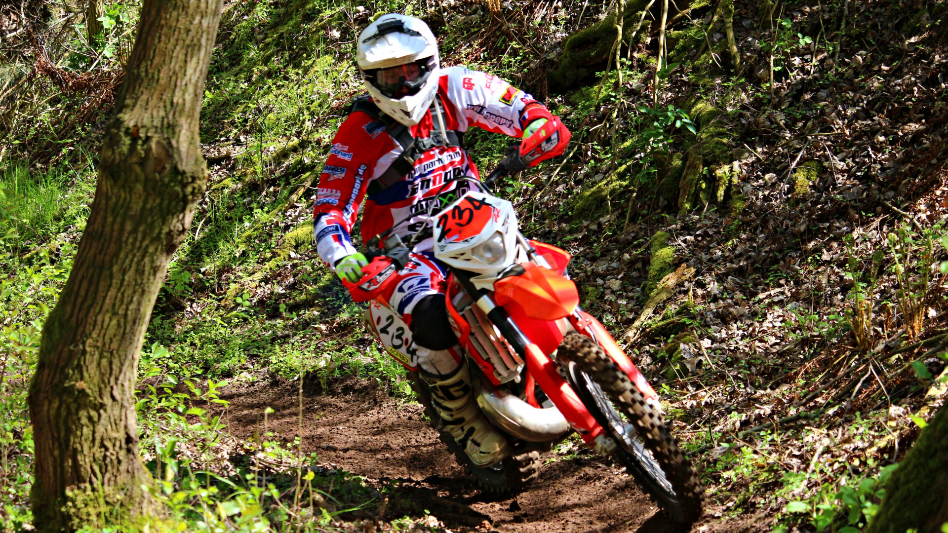 Man in Red and White Motocross Suit Riding Motocross Dirt Bike. Wallpaper in 1920x1080 Resolution