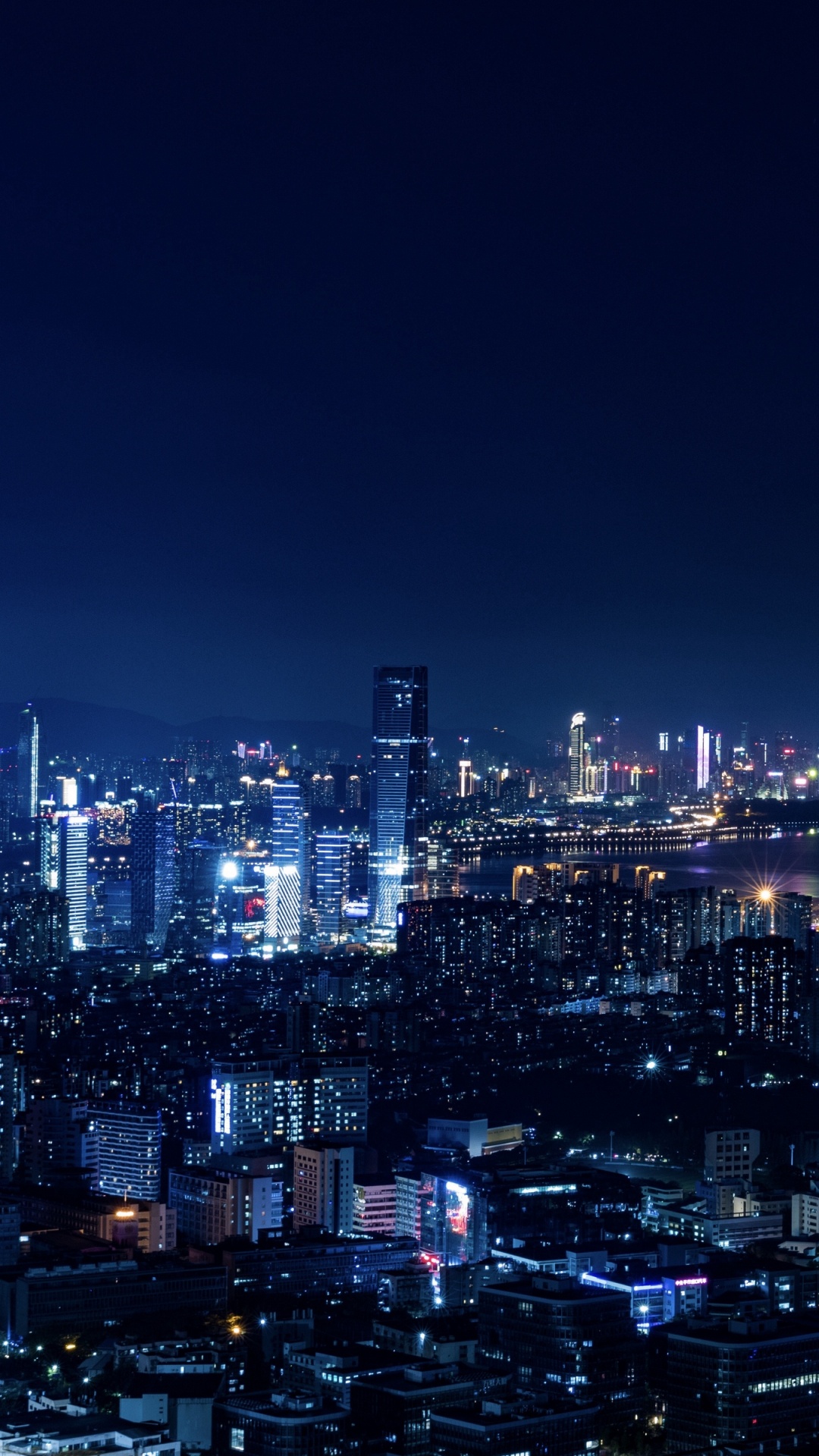 Stadt Mit Hochhäusern Während Der Nacht. Wallpaper in 1080x1920 Resolution