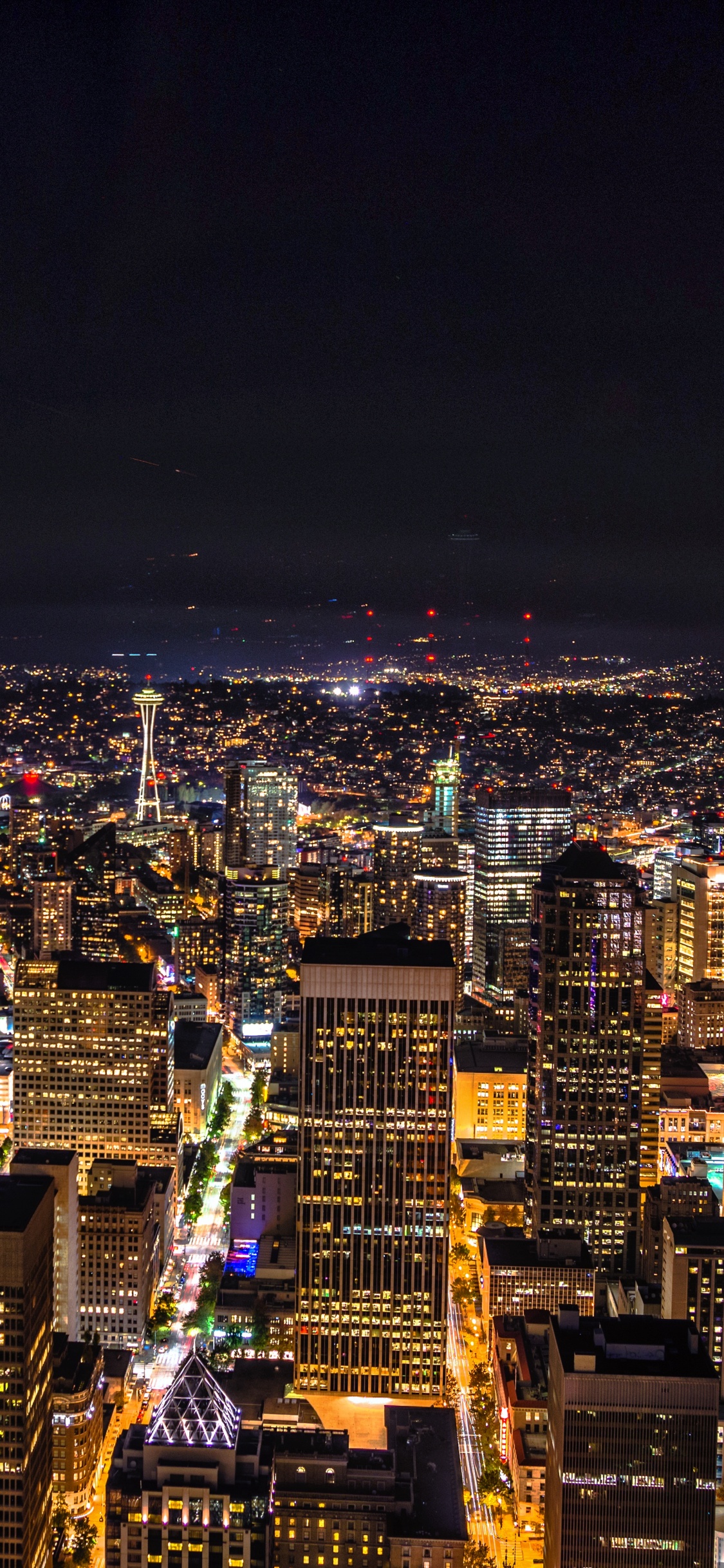 Aerial View of City During Night Time. Wallpaper in 1125x2436 Resolution