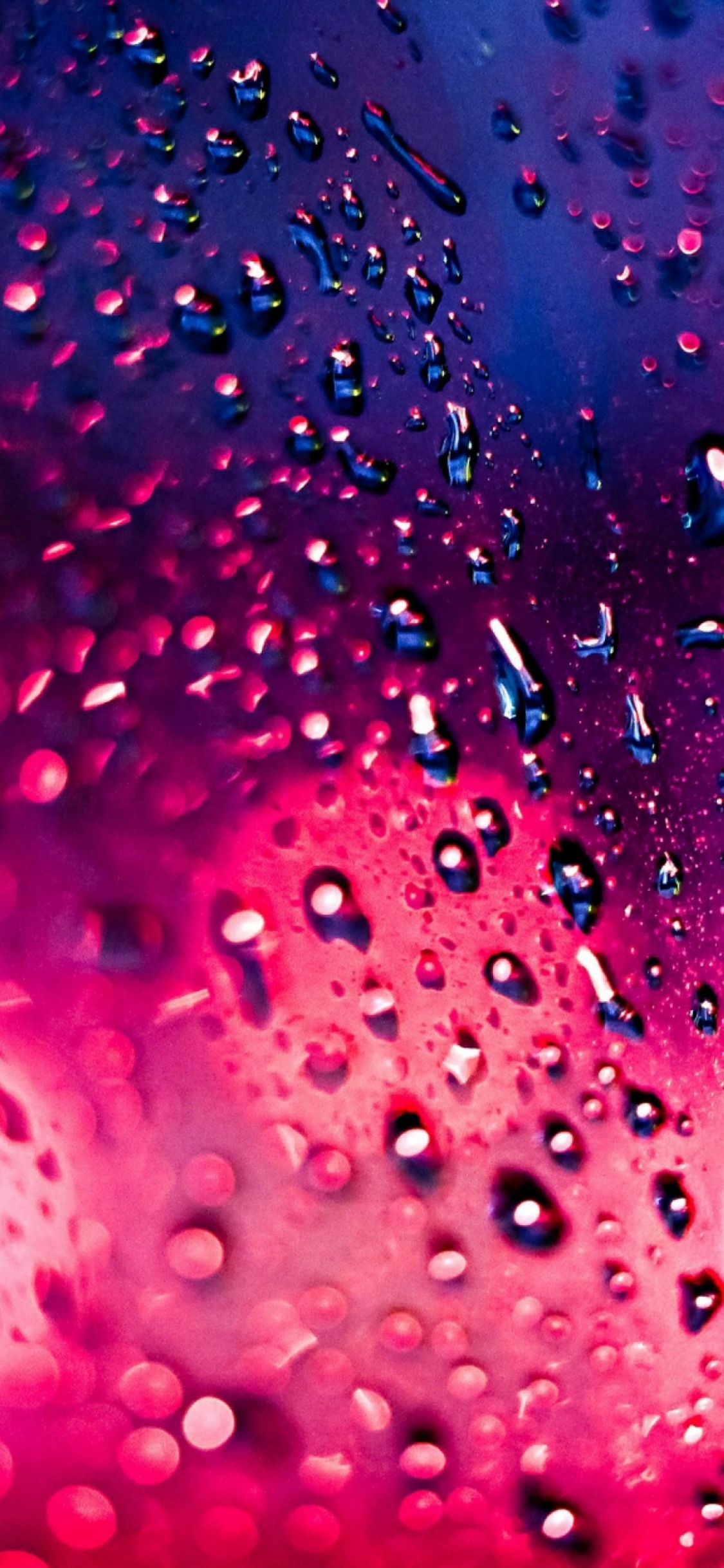 Pink and Blue Water Droplets. Wallpaper in 1125x2436 Resolution