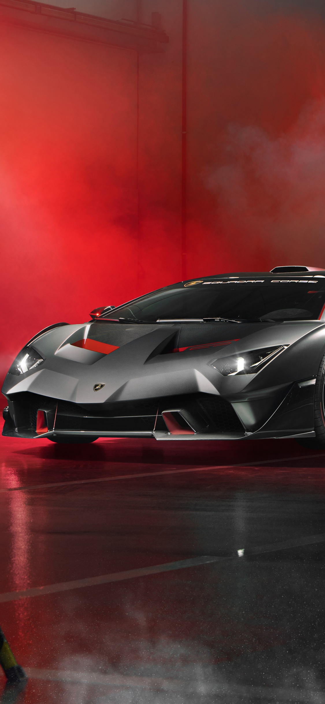 Schwarzer Lamborghini Aventador Auf Einem Roten Zimmer. Wallpaper in 1125x2436 Resolution