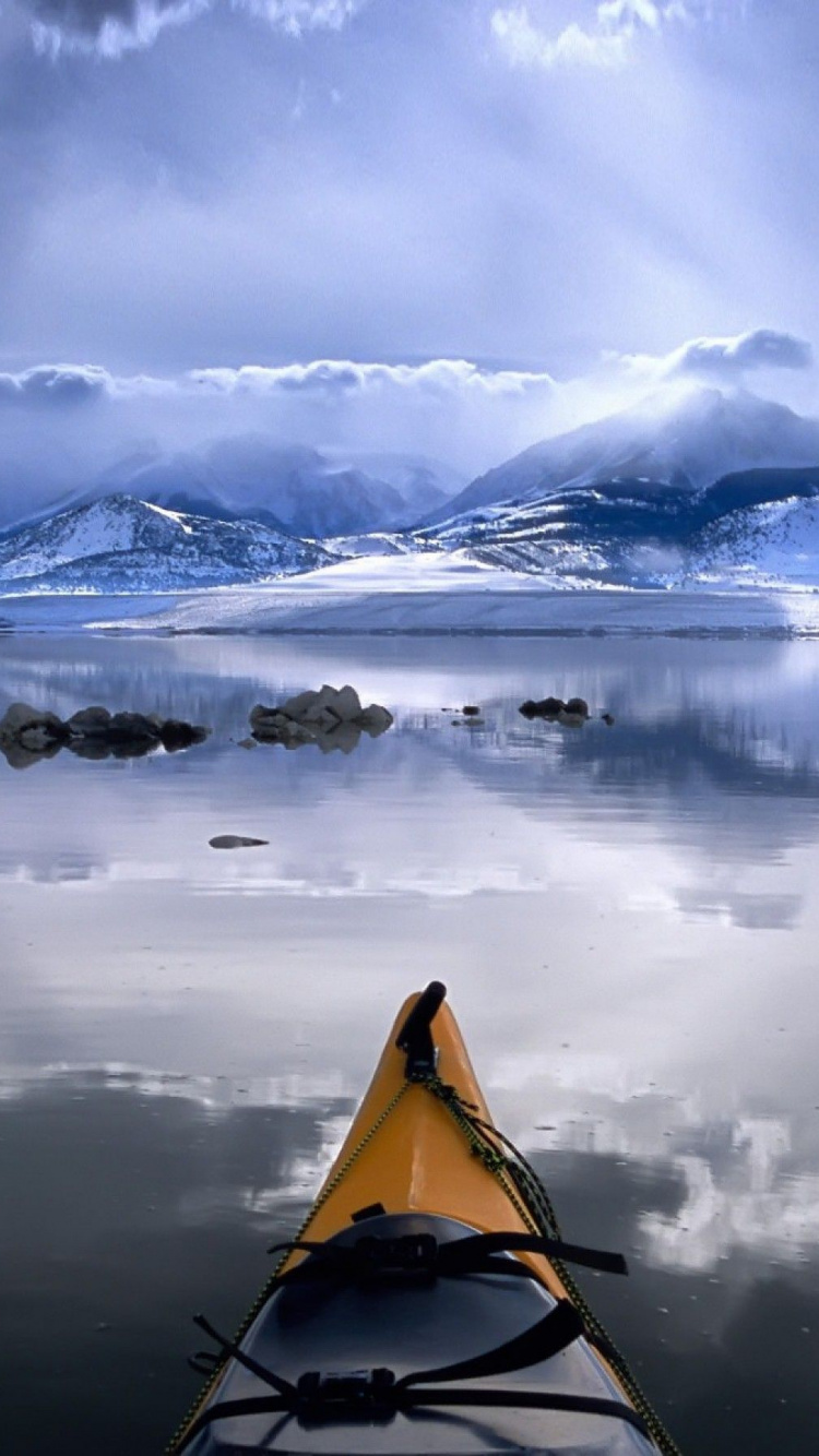 Snow Covered Mountain Near Body of Water During Daytime. Wallpaper in 750x1334 Resolution