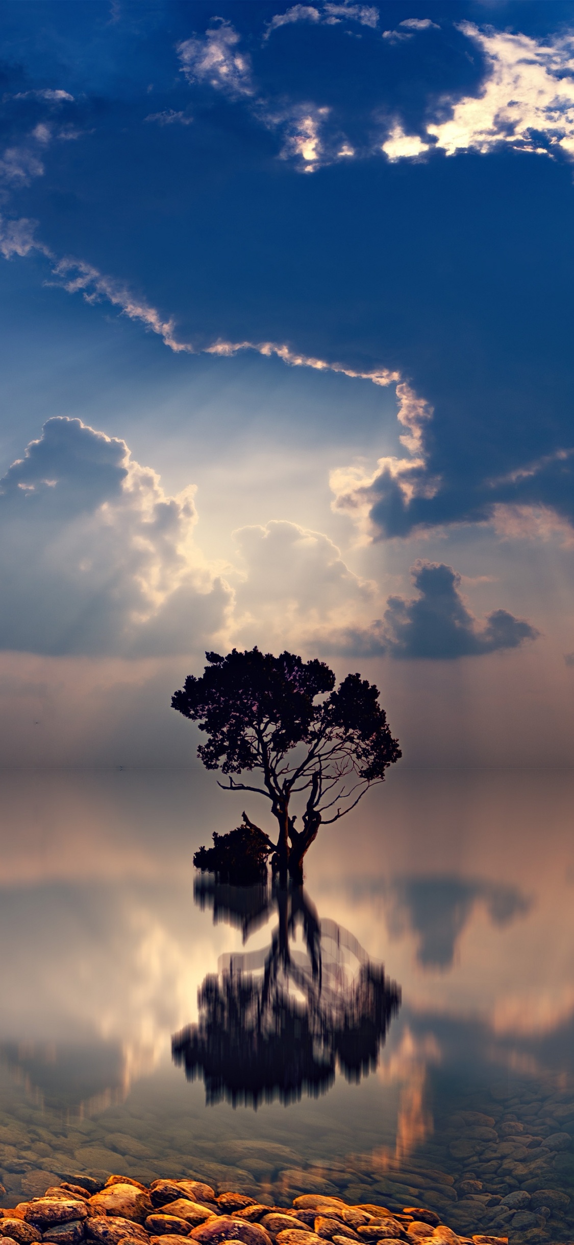 Body of Water Under Cloudy Sky During Daytime. Wallpaper in 1125x2436 Resolution