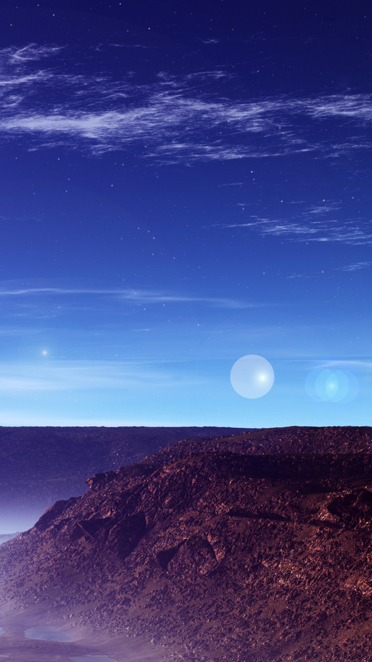 Montagnes Brunes et Noires Sous Ciel Bleu Pendant la Journée. Wallpaper in 750x1334 Resolution