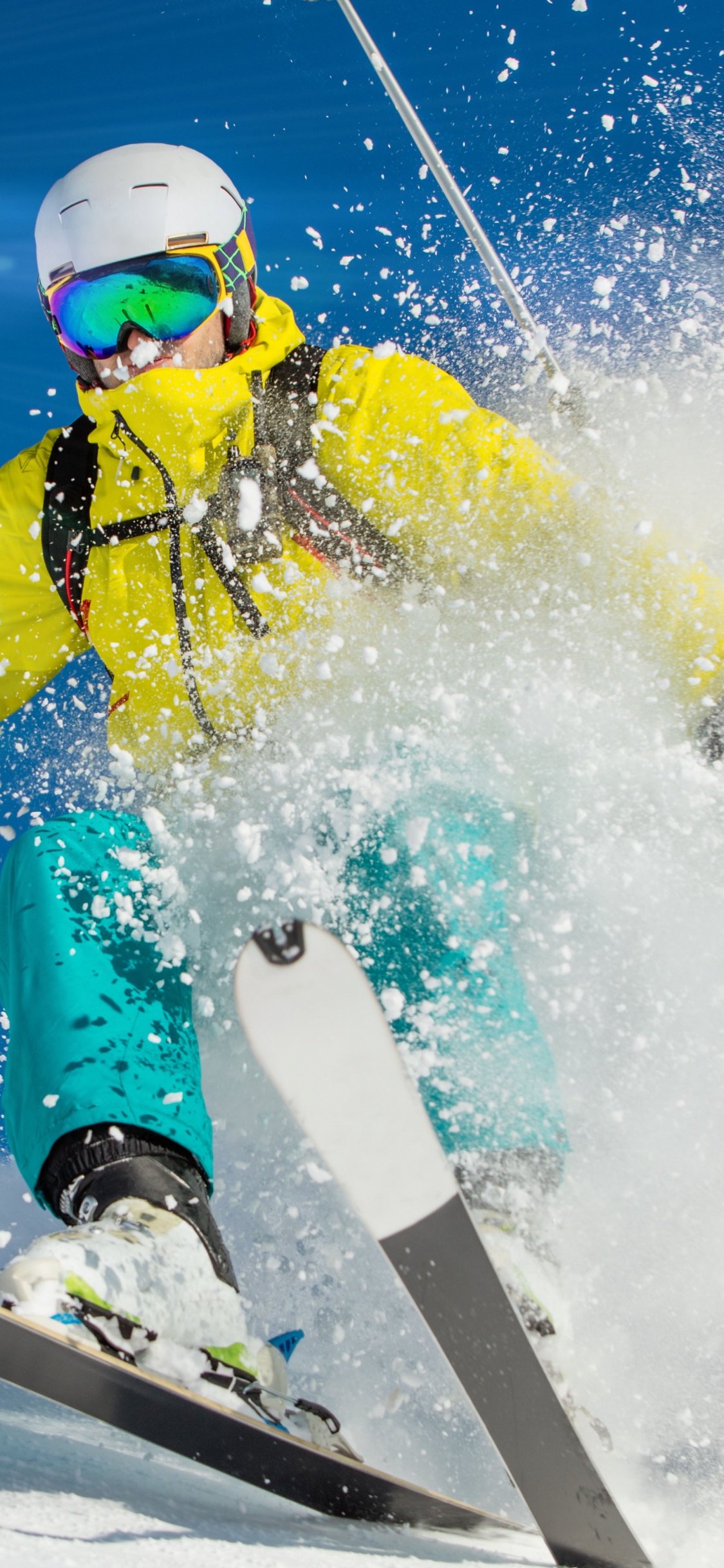 Person in Yellow Jacket and Red Helmet Riding on White and Red Snowboard During Daytime. Wallpaper in 1125x2436 Resolution