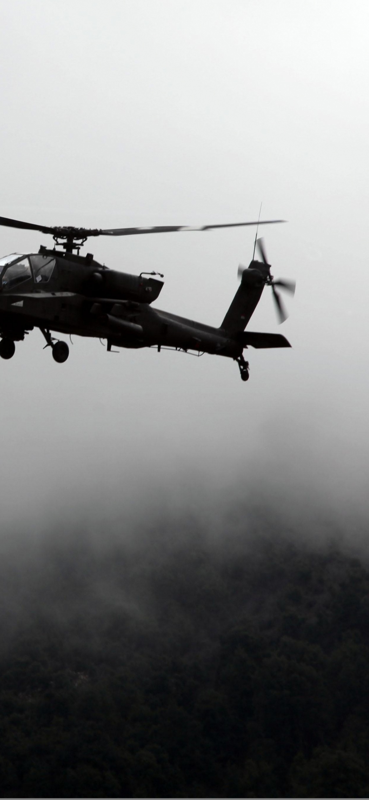 Helicóptero Negro Volando Sobre Las Nubes. Wallpaper in 1242x2688 Resolution
