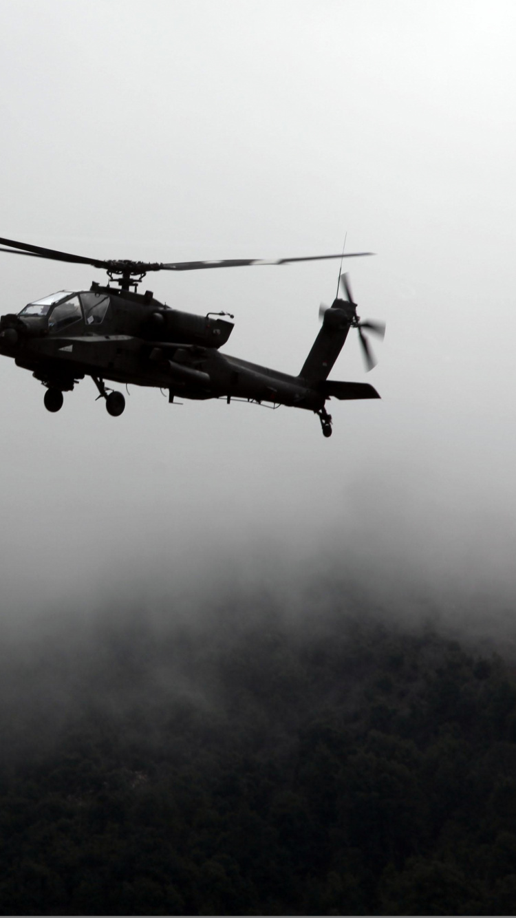 Helicóptero Negro Volando Sobre Las Nubes. Wallpaper in 750x1334 Resolution