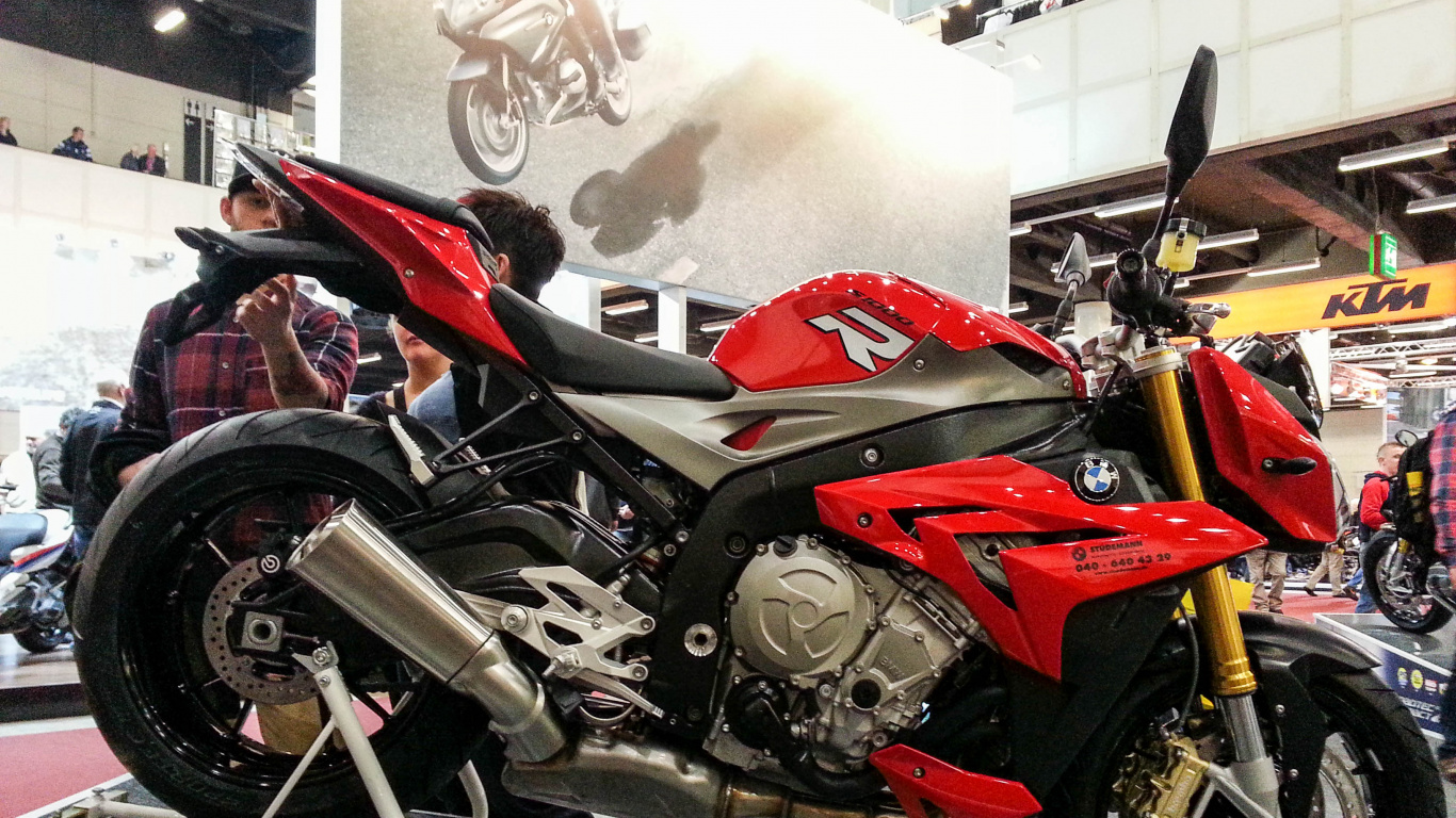 Red and Black Sports Bike Parked Beside White Wall. Wallpaper in 1366x768 Resolution