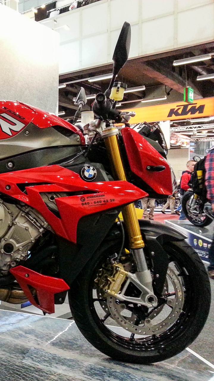 Red and Black Sports Bike Parked Beside White Wall. Wallpaper in 720x1280 Resolution