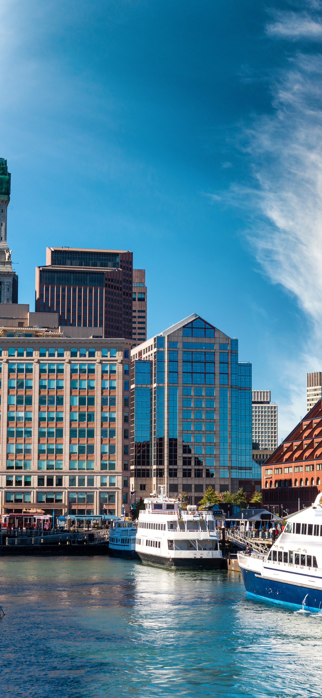 White and Blue Boat on Dock Near City Buildings During Daytime. Wallpaper in 1125x2436 Resolution