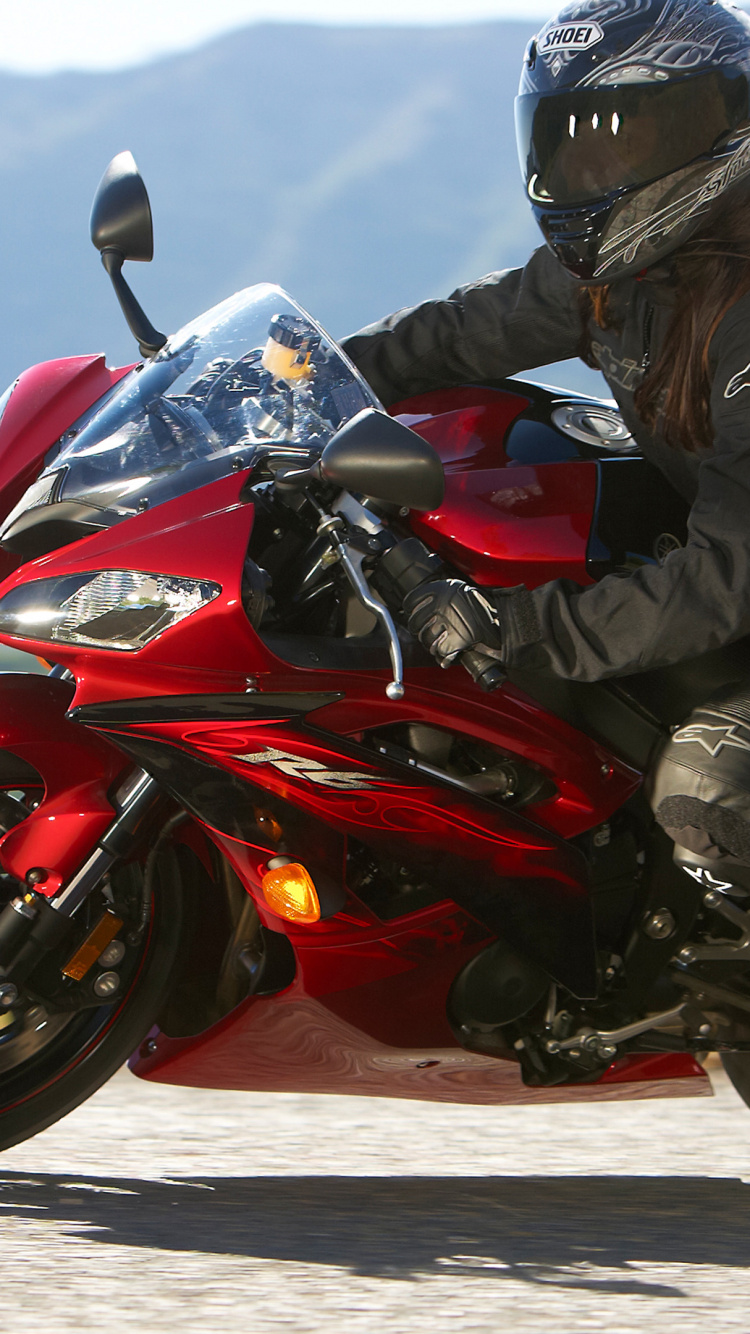 Man in Black Jacket Riding Red Sports Bike. Wallpaper in 750x1334 Resolution