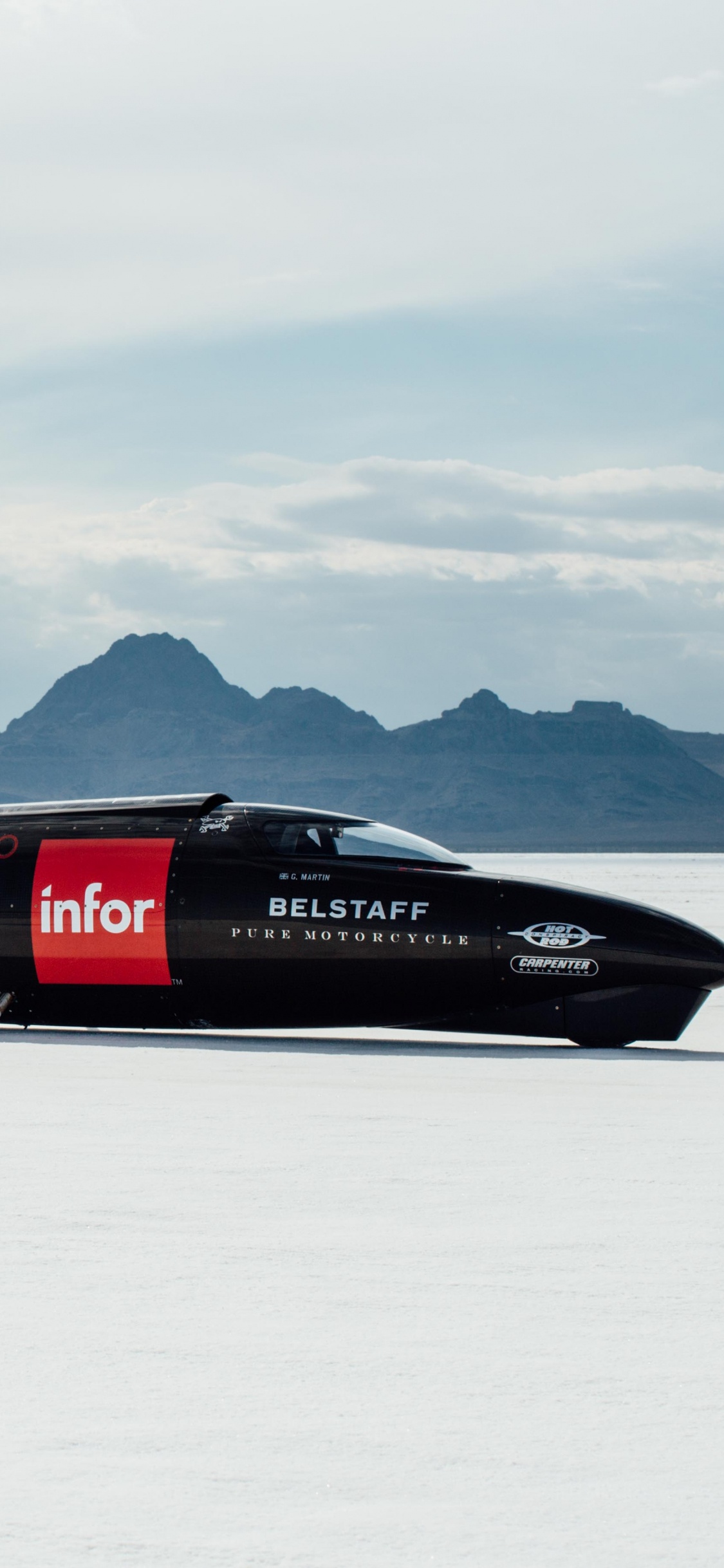 Red and Black Jet Plane on Snow Covered Ground During Daytime. Wallpaper in 1125x2436 Resolution