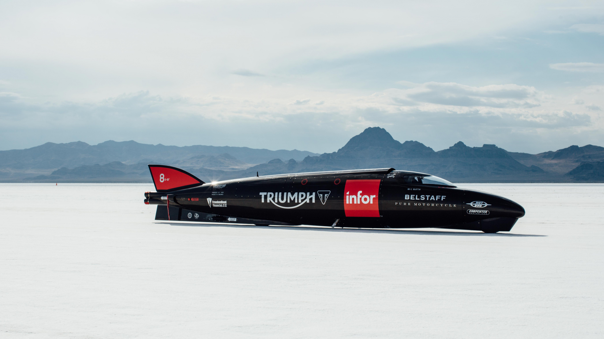 Red and Black Jet Plane on Snow Covered Ground During Daytime. Wallpaper in 2560x1440 Resolution