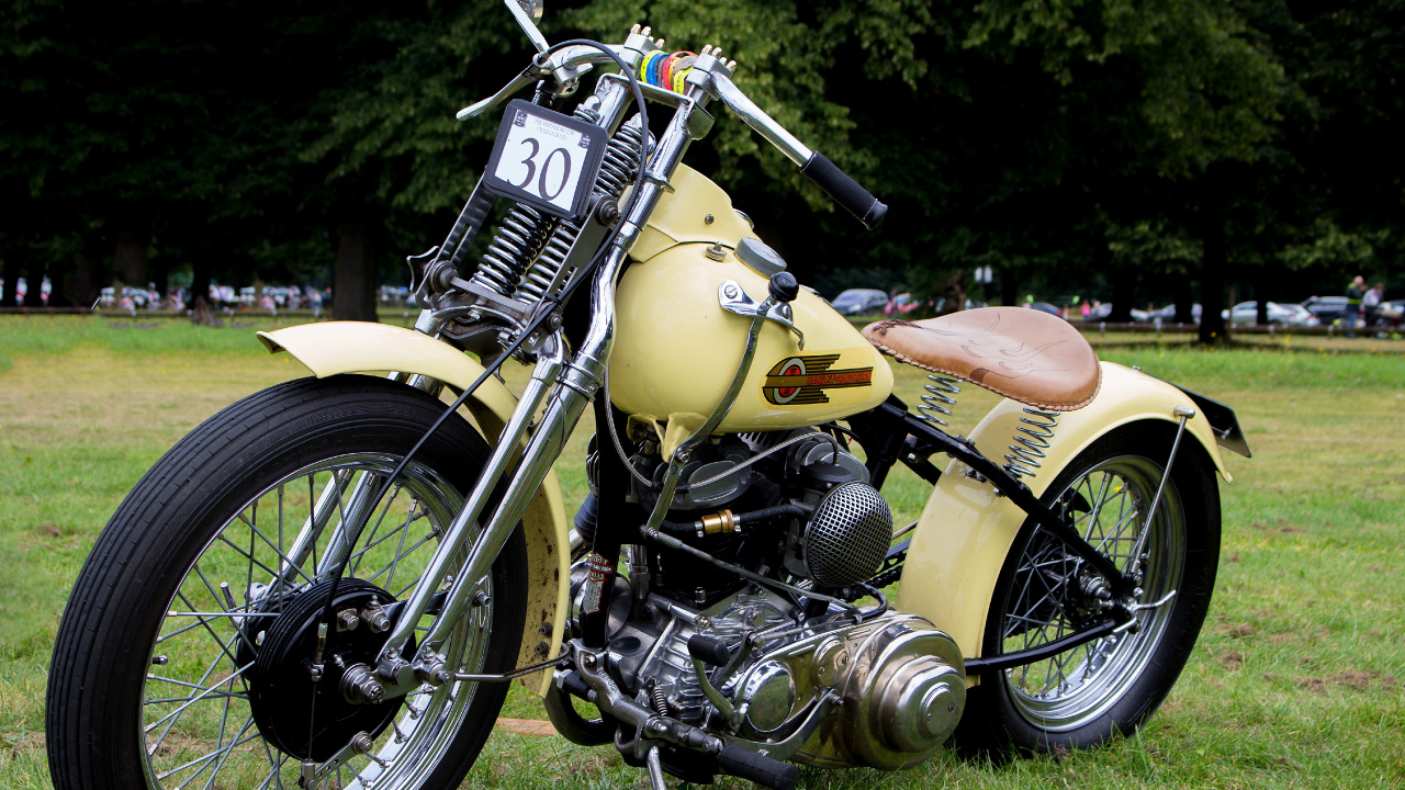 Yellow and Black Cruiser Motorcycle on Green Grass Field During Daytime. Wallpaper in 1280x720 Resolution