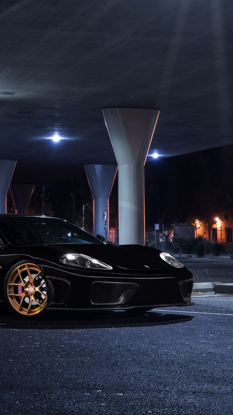 Black Porsche 911 Parked on Parking Lot. Wallpaper in 750x1334 Resolution