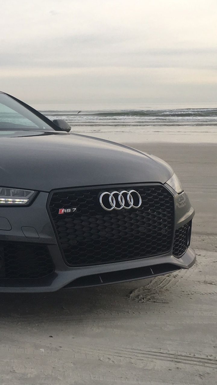Coupé Audi Noir Sur Sable Gris Pendant la Journée. Wallpaper in 720x1280 Resolution