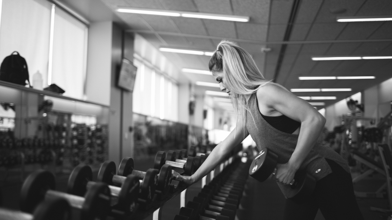 Woman in Black Tank Top Doing Exercise. Wallpaper in 1280x720 Resolution