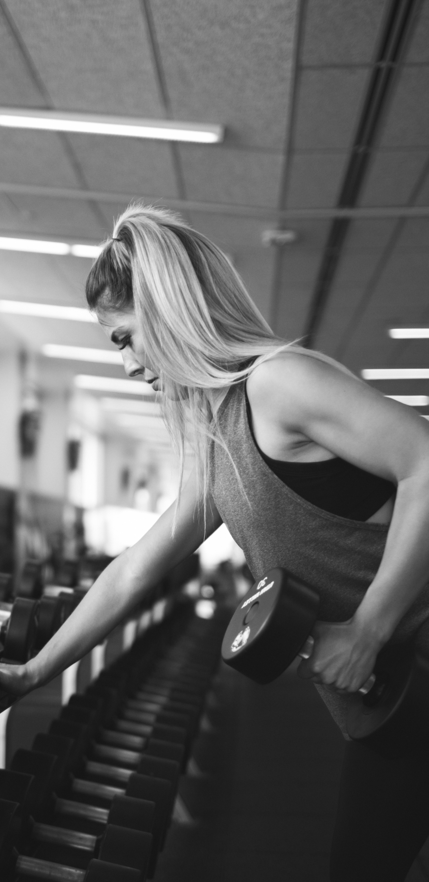 Woman in Black Tank Top Doing Exercise. Wallpaper in 1440x2960 Resolution