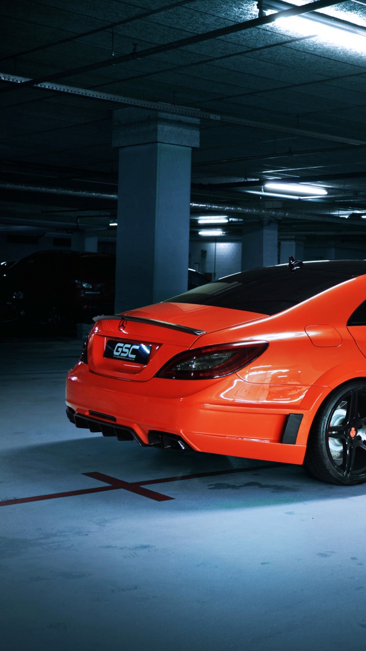 Orange Ferrari 458 Italia Parked in Building. Wallpaper in 720x1280 Resolution