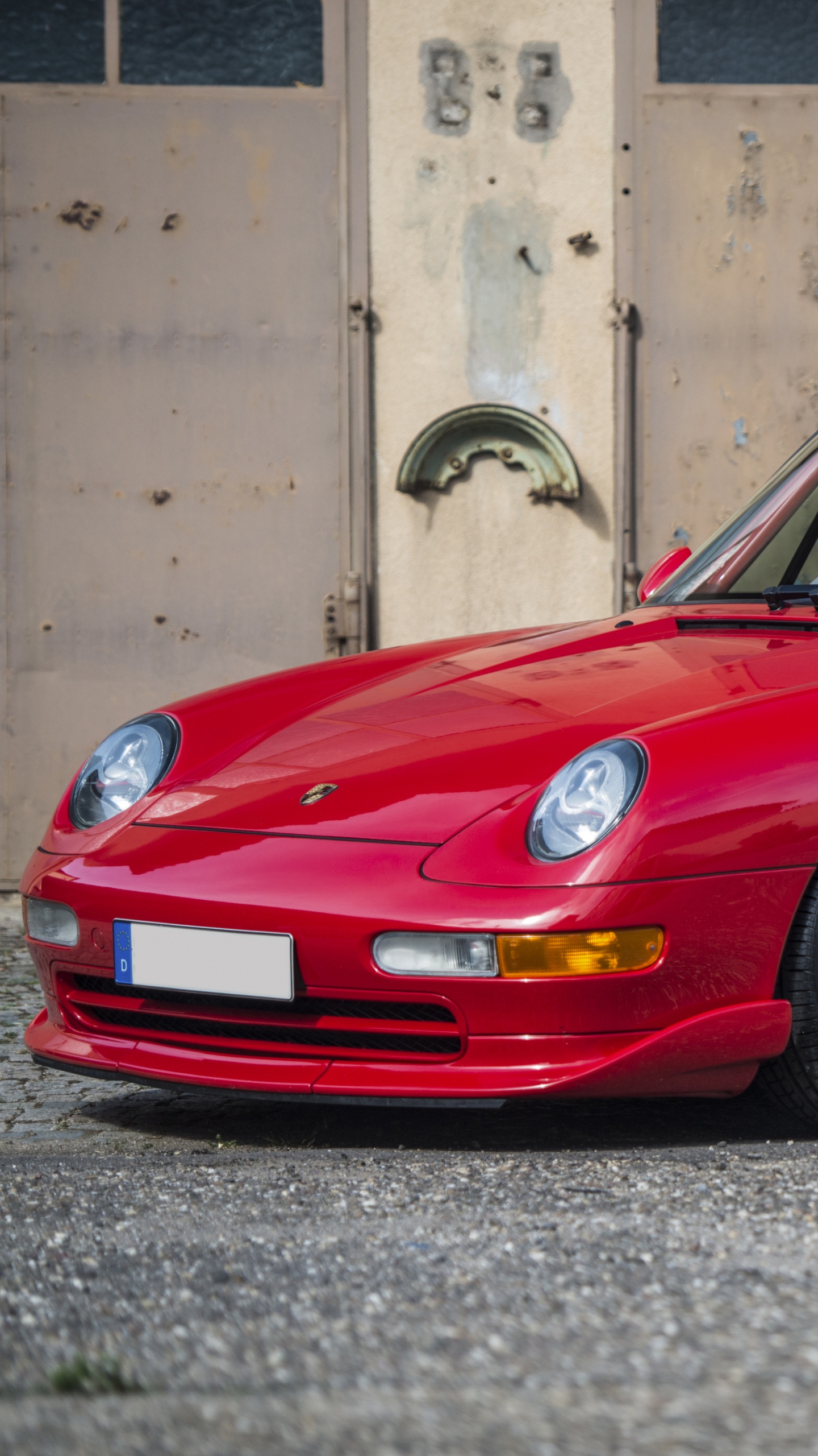 Red Porsche 911 Parked on Grey Concrete Pavement. Wallpaper in 1440x2560 Resolution