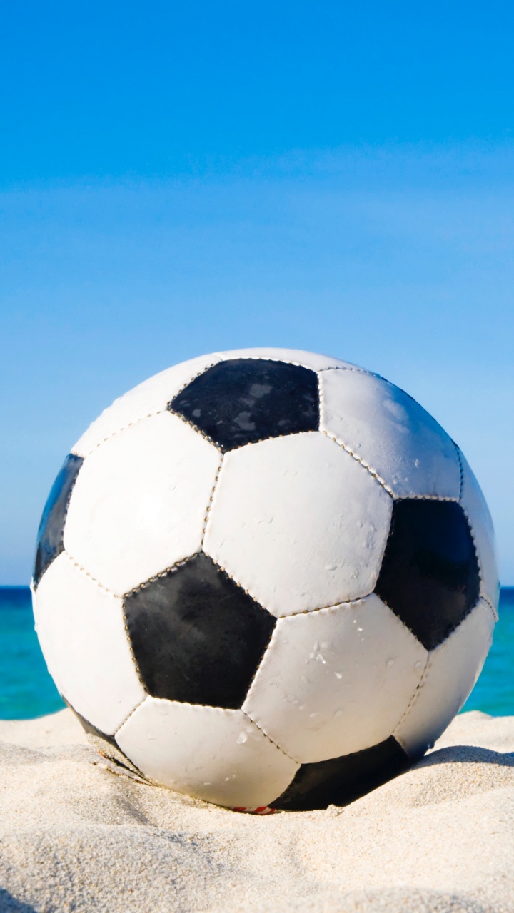 White and Black Soccer Ball on White Sand During Daytime. Wallpaper in 720x1280 Resolution