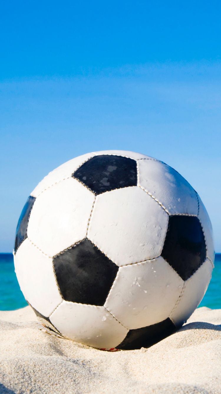 White and Black Soccer Ball on White Sand During Daytime. Wallpaper in 750x1334 Resolution