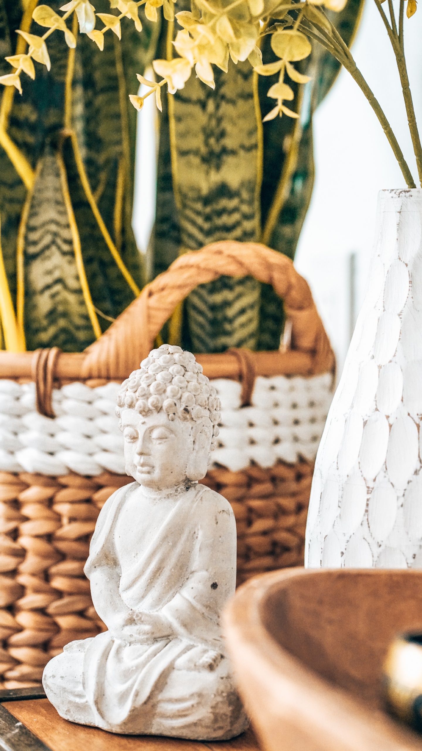 Angel Ceramic Figurine on Brown Woven Basket. Wallpaper in 1440x2560 Resolution