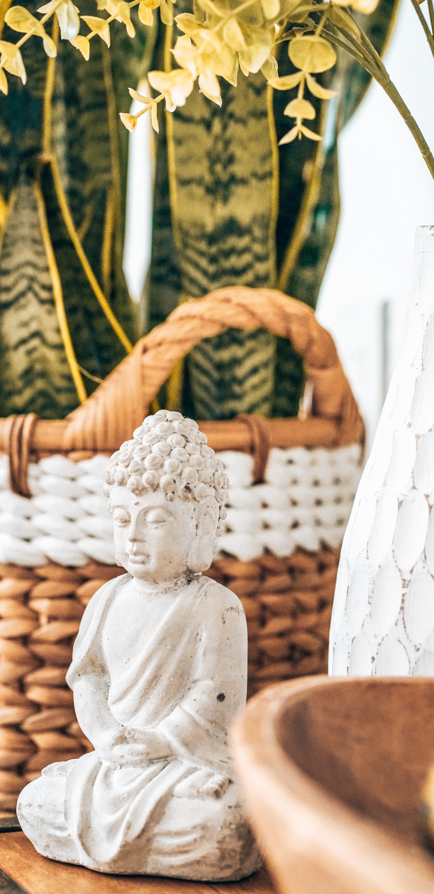 Angel Ceramic Figurine on Brown Woven Basket. Wallpaper in 1440x2960 Resolution