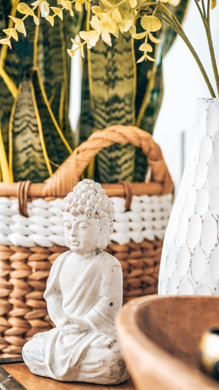 Angel Ceramic Figurine on Brown Woven Basket. Wallpaper in 750x1334 Resolution