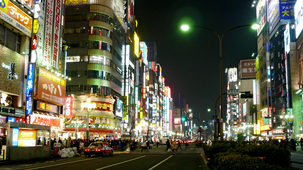 City Buildings With Lights Turned on During Night Time. Wallpaper in 1280x720 Resolution