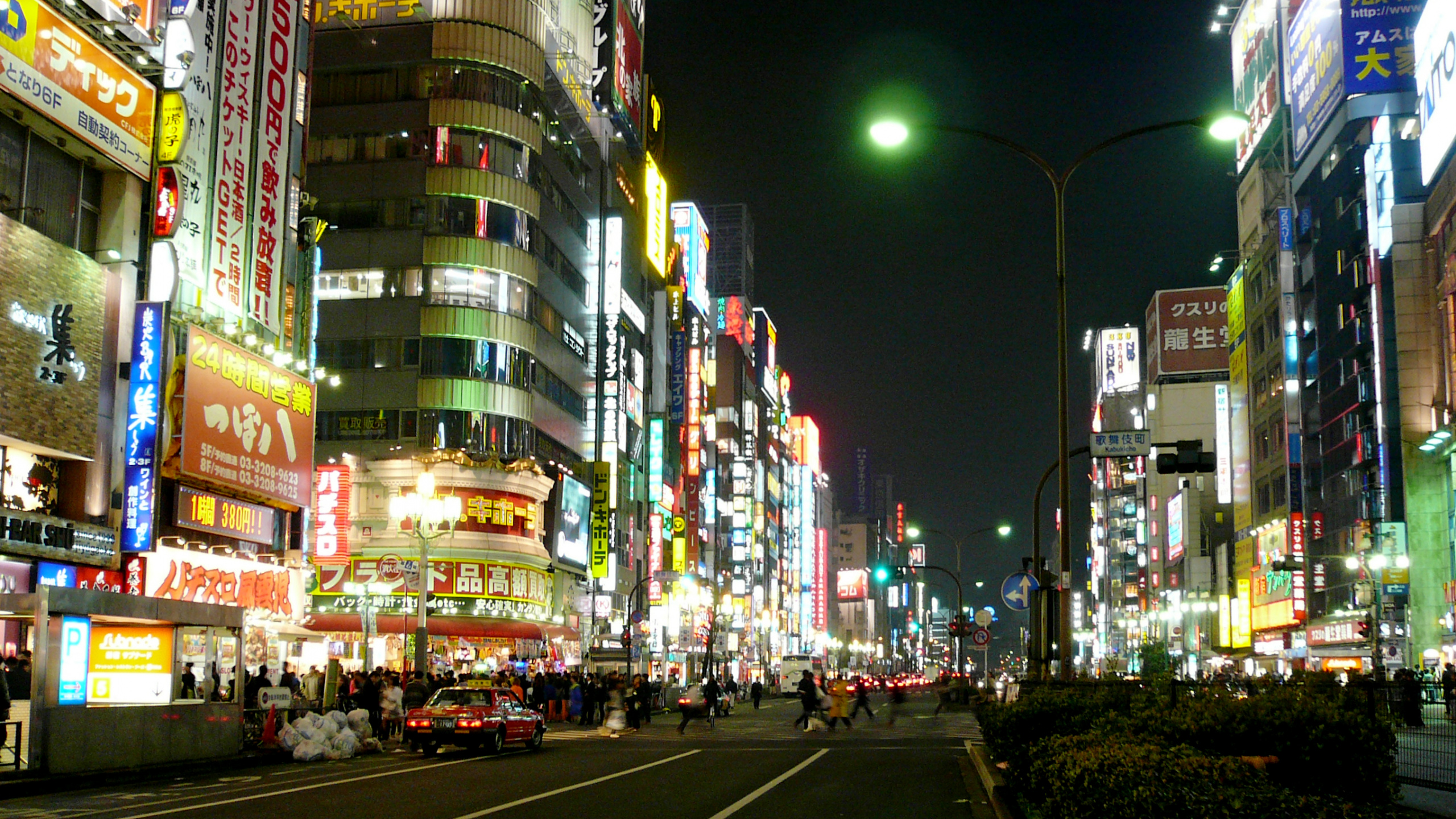 City Buildings With Lights Turned on During Night Time. Wallpaper in 2560x1440 Resolution