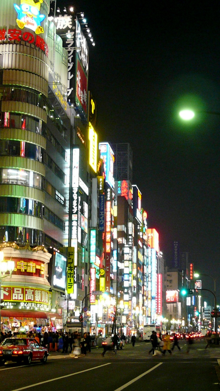 City Buildings With Lights Turned on During Night Time. Wallpaper in 720x1280 Resolution