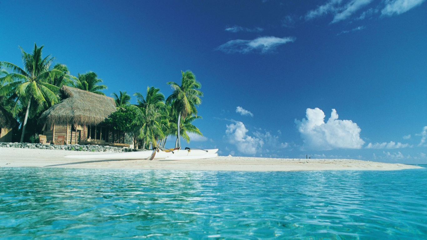 Brown Wooden House on Beach During Daytime. Wallpaper in 1366x768 Resolution