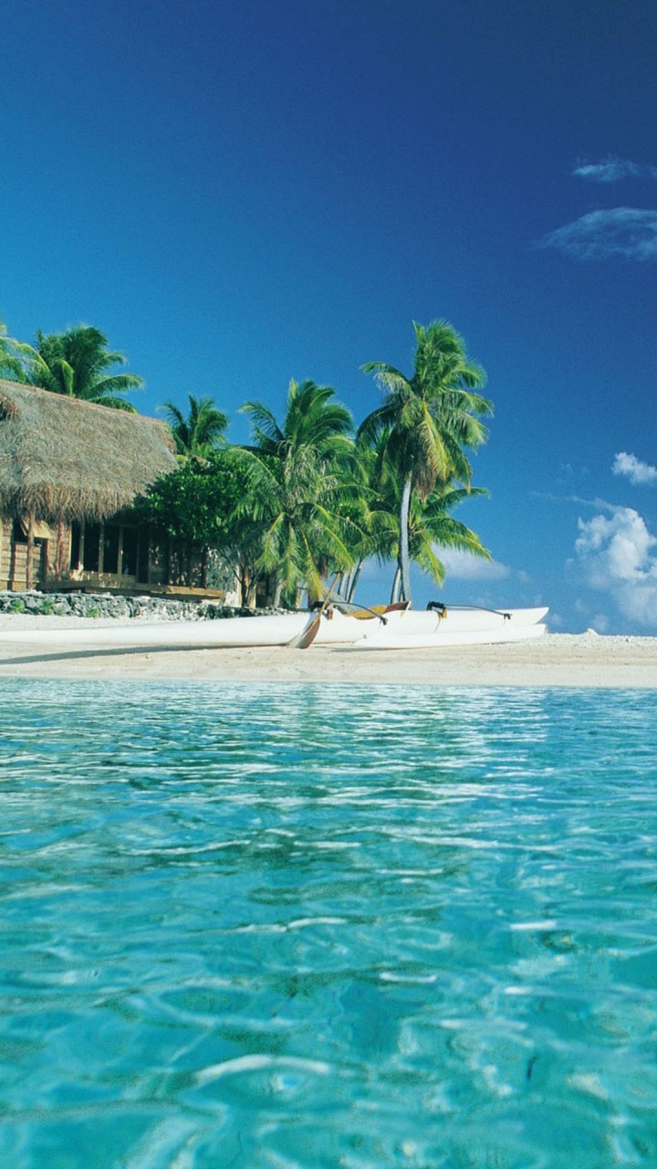 Brown Wooden House on Beach During Daytime. Wallpaper in 720x1280 Resolution