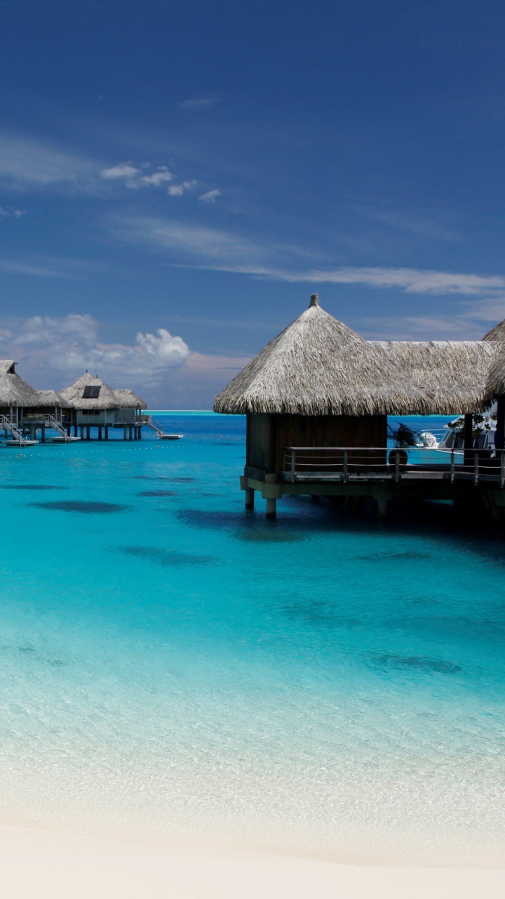 Brown Wooden Beach House on Beach During Daytime. Wallpaper in 720x1280 Resolution