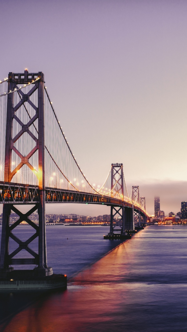Bridge Over Water During Night Time. Wallpaper in 720x1280 Resolution