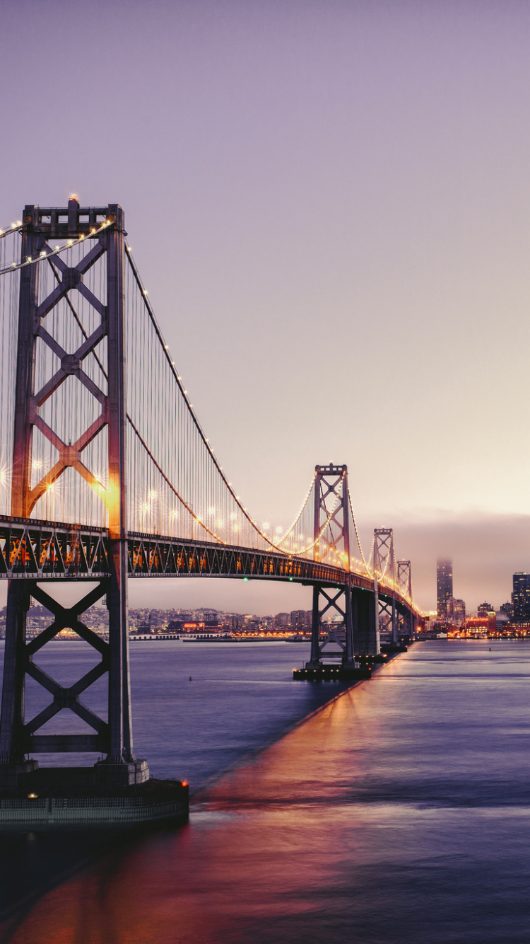 Bridge Over Water During Night Time. Wallpaper in 750x1334 Resolution