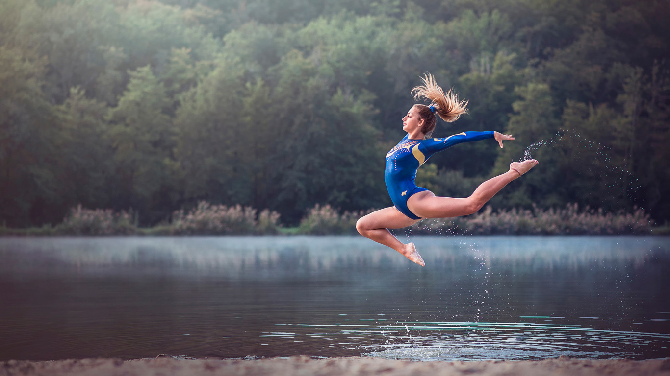 Woman in Blue One Piece Swimsuit Jumping on Water During Daytime. Wallpaper in 1366x768 Resolution