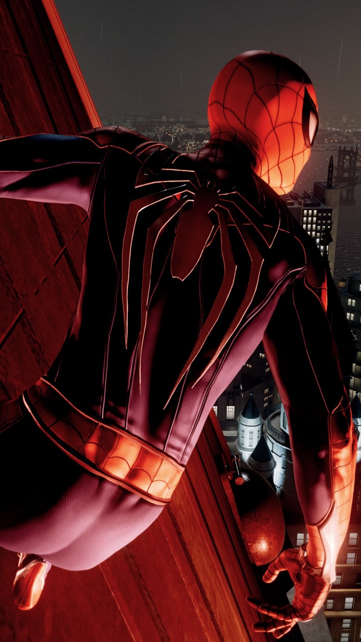 Man in Black and Red Striped Hoodie Standing on Red Light. Wallpaper in 720x1280 Resolution