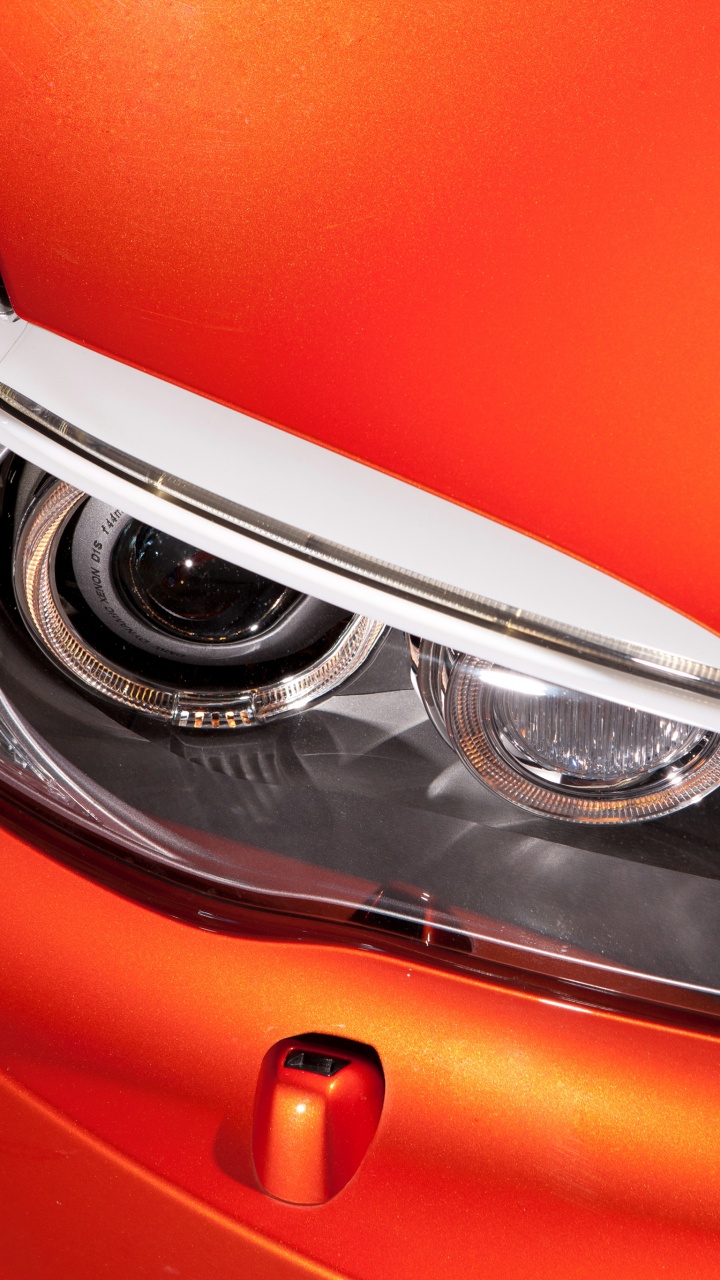 Orange Car With Chrome Front Wheel. Wallpaper in 720x1280 Resolution