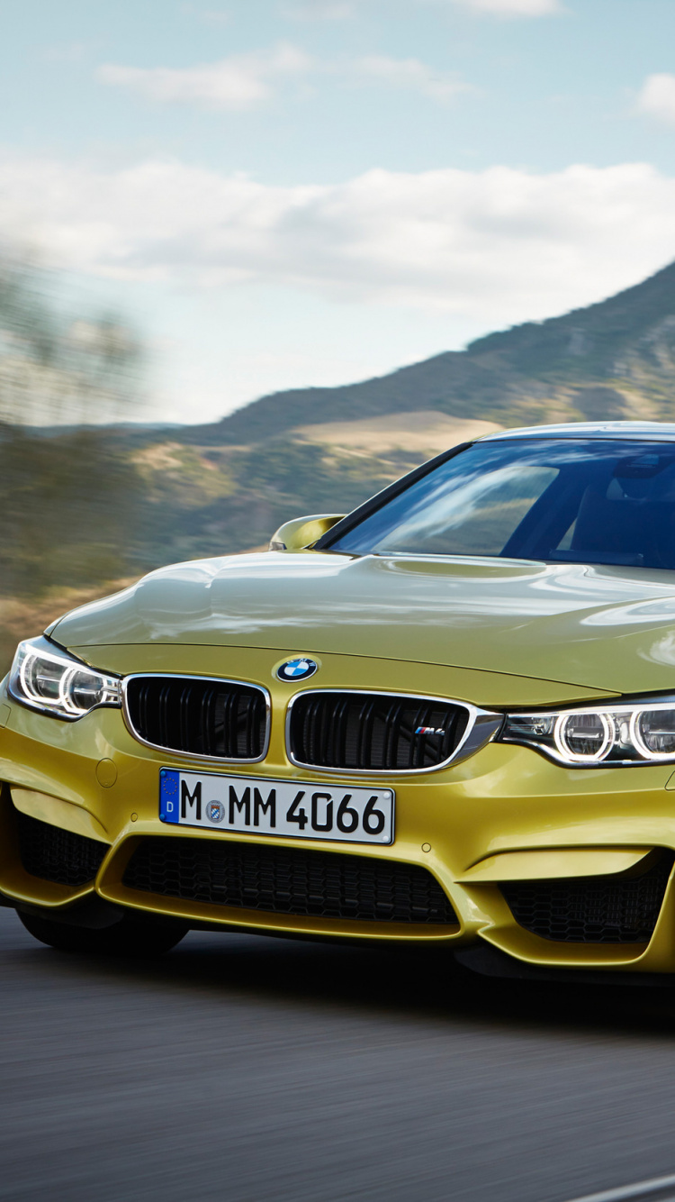 Gelber Bmw m 3 Tagsüber Unterwegs. Wallpaper in 750x1334 Resolution