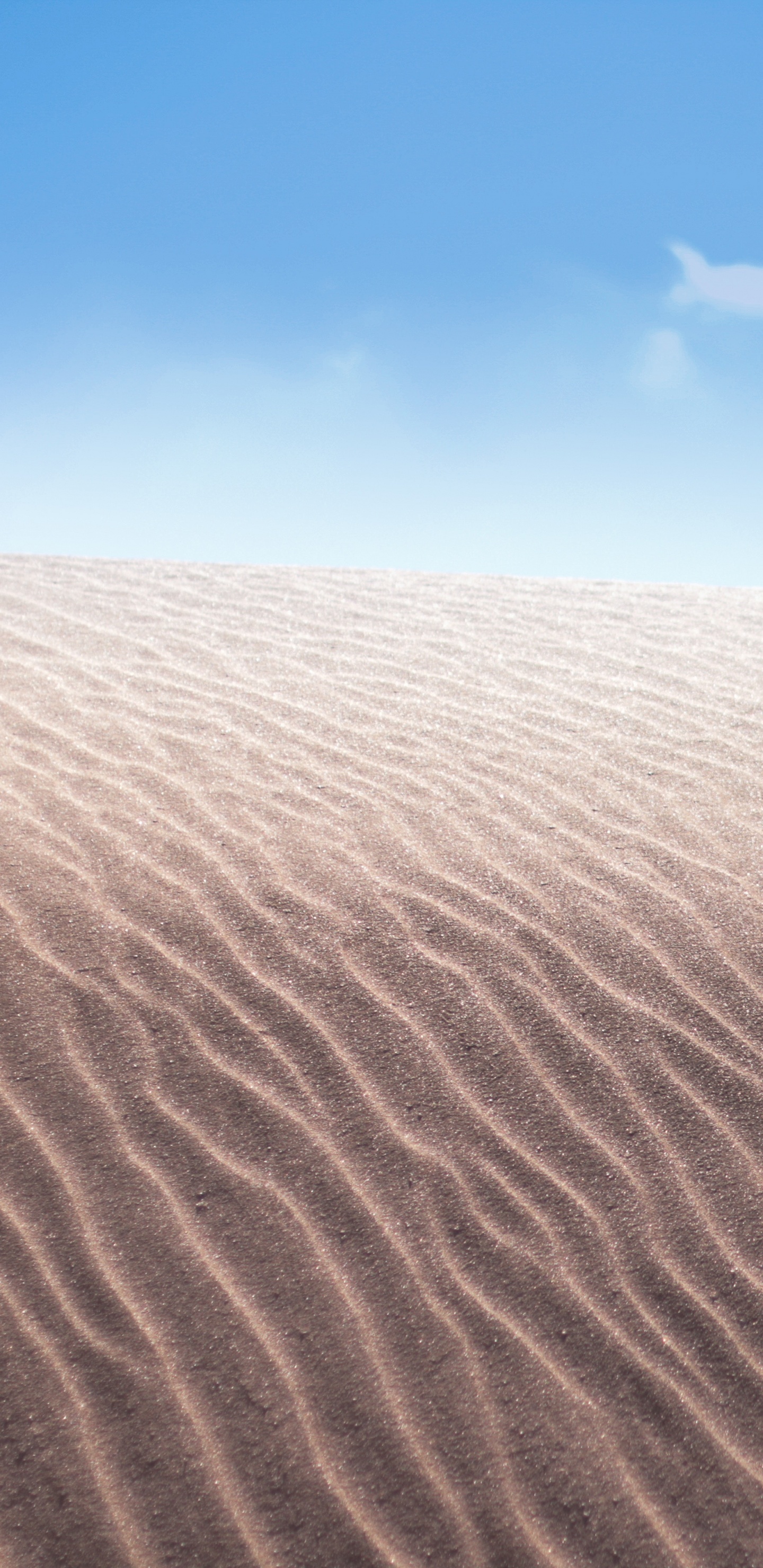 Brown Sand Under Blue Sky During Daytime. Wallpaper in 1440x2960 Resolution