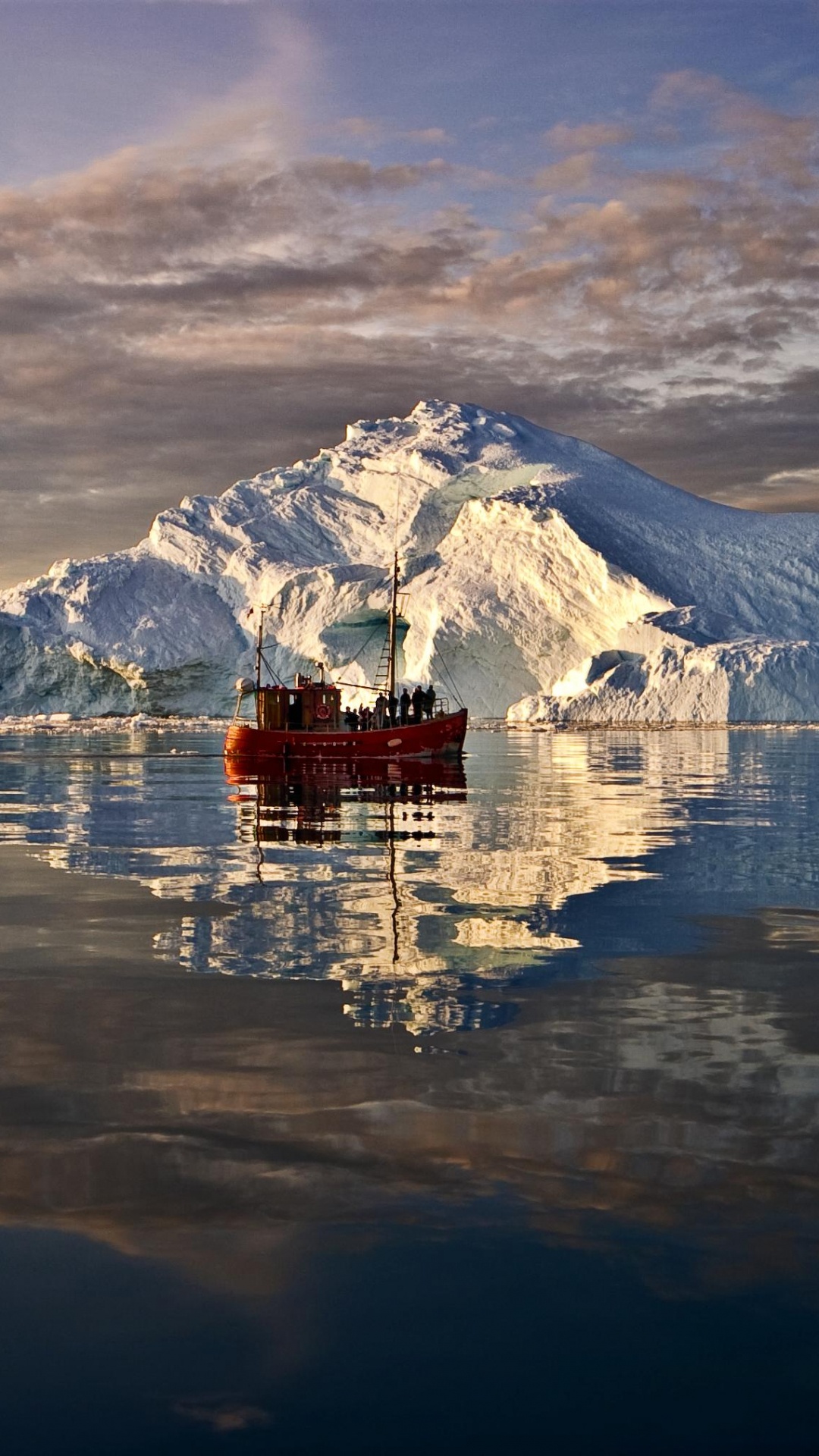 White and Brown House on Snow Covered Ground Near Body of Water. Wallpaper in 1080x1920 Resolution