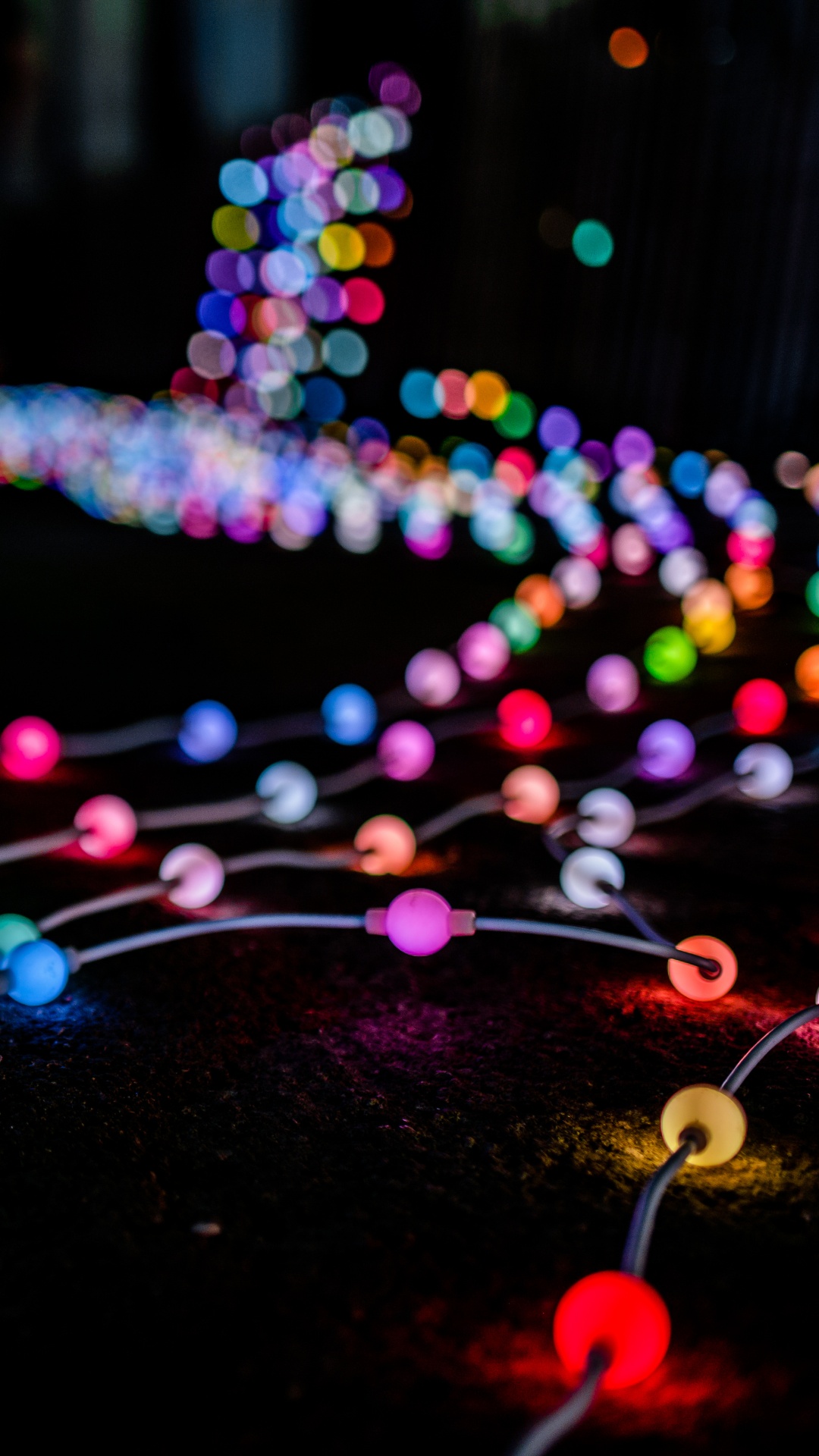 Blue Pink and Yellow String Lights. Wallpaper in 1080x1920 Resolution
