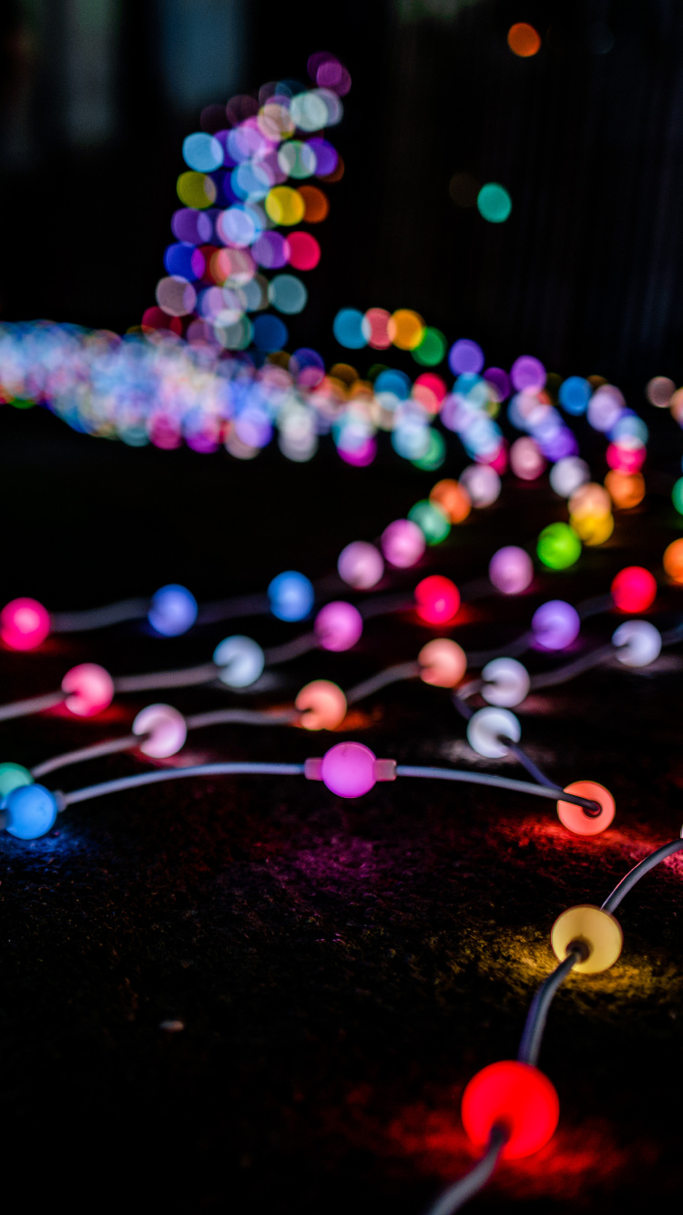 Blue Pink and Yellow String Lights. Wallpaper in 750x1334 Resolution
